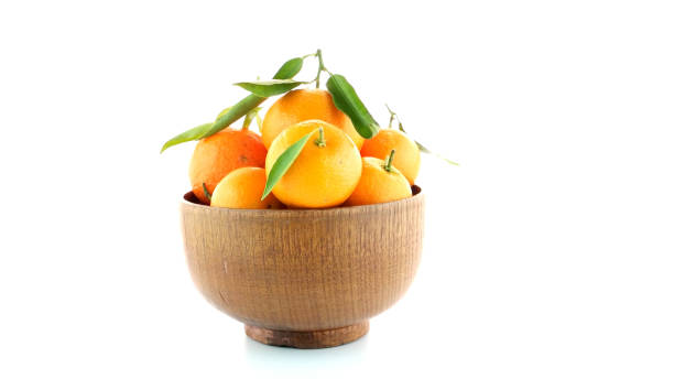 istock Tangerines on wooden  bowl 1741728666