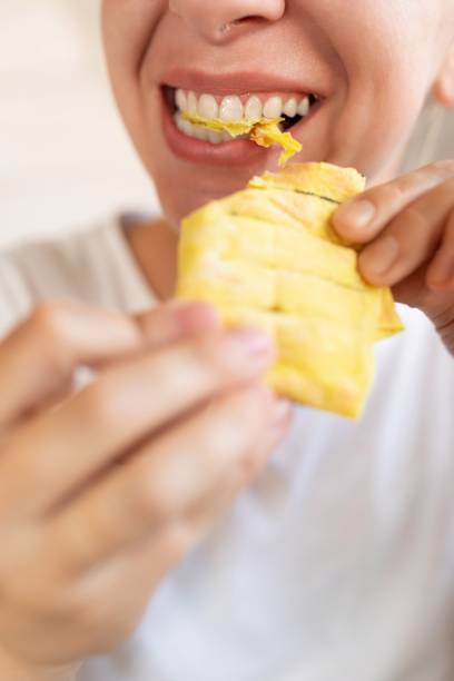 istock young woman enjoying food while dieting 1741728672
