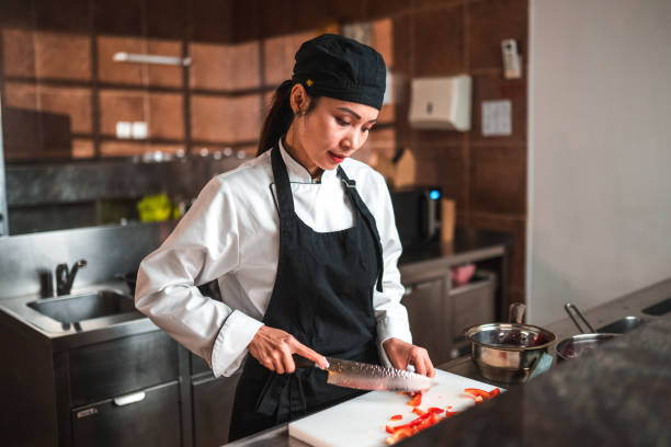 istock A Perfect Cut, Skilled Female Chef in Modern Kitchen 1741732599