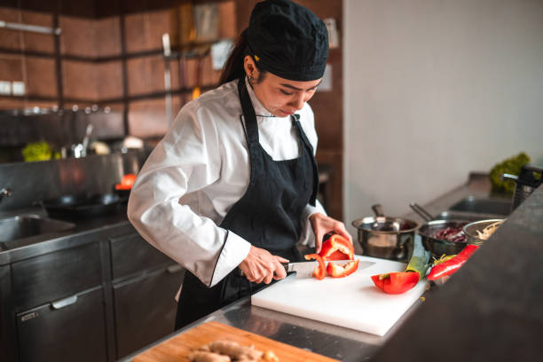 istock Beautiful Woman Cutting Ingredients 1741732603