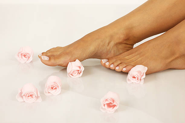 istock Pedicured feet  with beautiful flowers 174175022