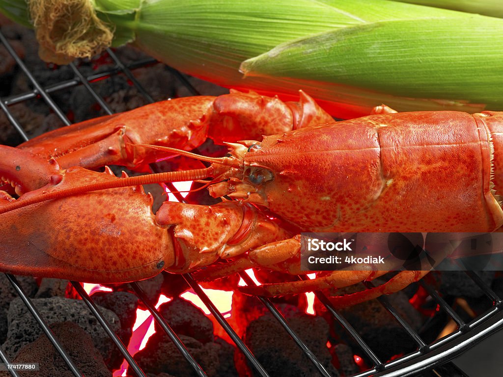 Lobster on BBQ Grill BBQ Grill with Seafood and Sweet Corn. Barbecue Grill Stock Photo