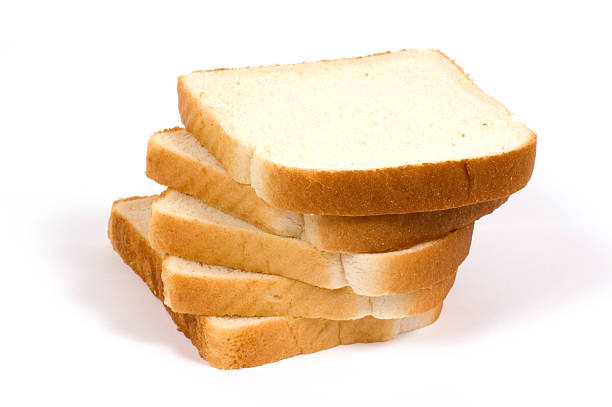 Five slices of white bread on background stock photo