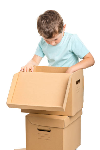 istock portrait of small boy with boxes 174181471