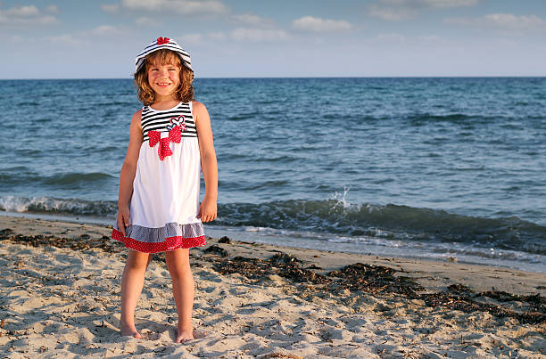 Free Stock Photo of Young Girl Standing on Beach by Water | Download ...