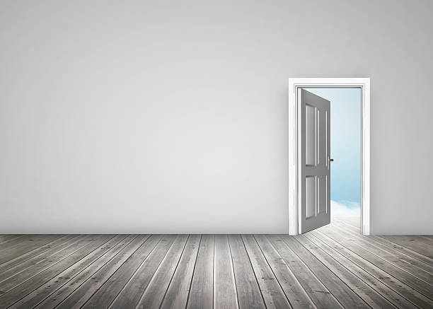 istock Doorway opening to blue sky in grey room 174181559