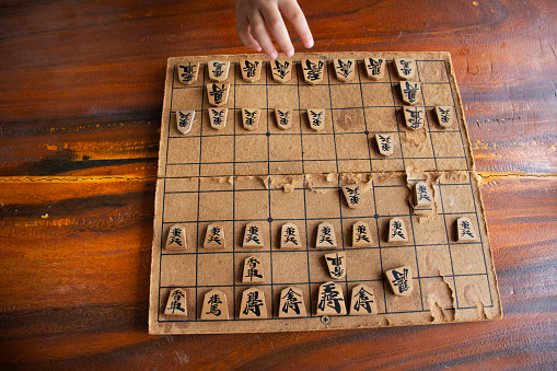 Wood board of japanese chess or Shogi board game on wooden table for children kid player playing in competition match at Wat Khao Din Temple at Suphanburi on October 7, 2023 in Suphan Buri, Thailand
