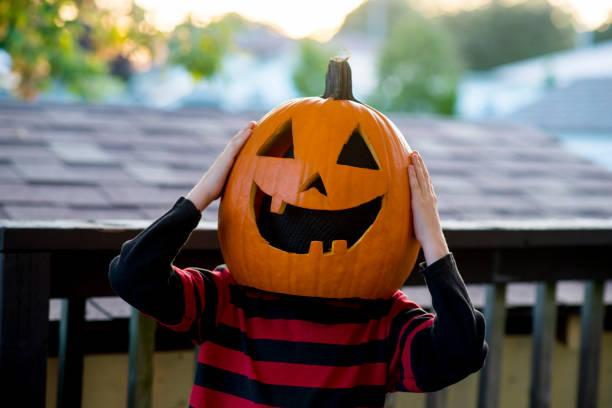 istock Pumpkin Head Child Looking Suprised 1741835258