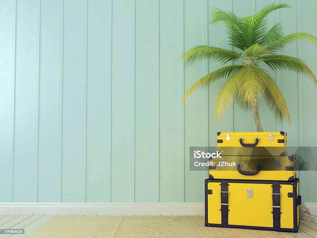 Yellow bags and palm tree Bright yellow bags on the background of blue wall and a beautiful palm tree Backgrounds Stock Photo