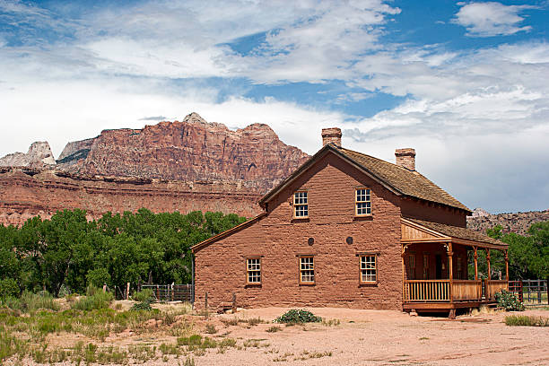 The John and Ellen Woods homestead from the 1850's in the Ghost Town of Grafton, Utah with buttes in background 