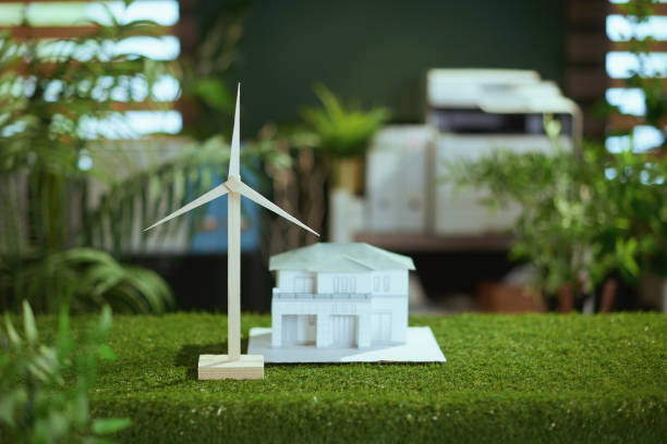 istock grass table in modern green office with paper house 1741841750
