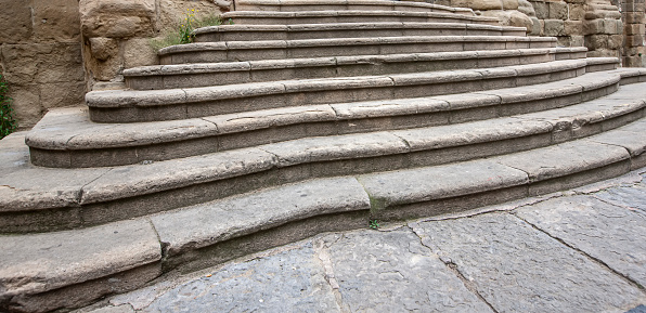 The ancient medieval wide stone staircase. Selective focus