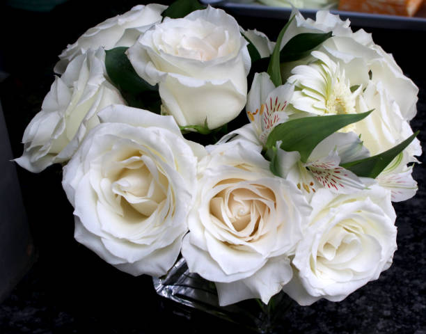 istock Centrepiece flower bouquet of white carnations and daisies 1741854669