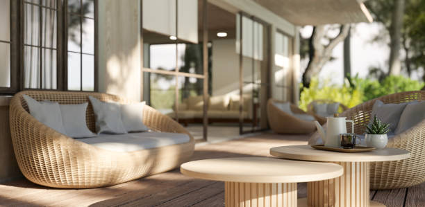 istock Copy space on a wooden coffee table on a beautiful deck with wicker sofa and a beautiful nature view 1741859231