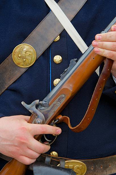 istock Civil War Reenactor Holds His Musket 174187530