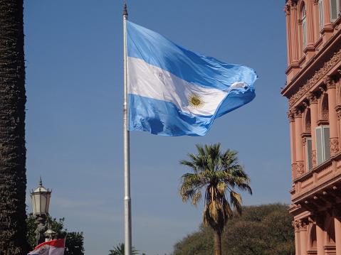 The ''Casa Rosada'' is the government house of the president of Argentina. Argentinian flag waving over flagpole in a sunny and beautiful day.