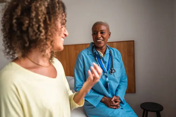 Doctor's optimistic conversation with woman patient