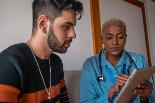 istock Patient attentive to exams on doctor's tablet 1741930669