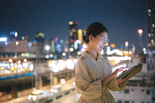 istock Asian modern Business people consult invest performance tracking form chart and graph on her digital tablet 1741940440