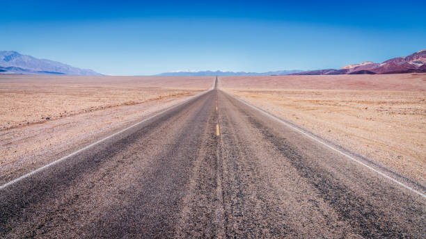 Free Stock Photo of Remote Road Stretching Across Vast Desert Landscape ...