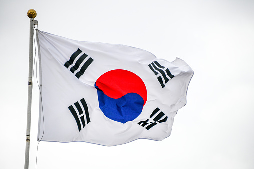 South Korea flag waving in the wind with blue sky background