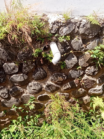 small drainage pipe in the wall