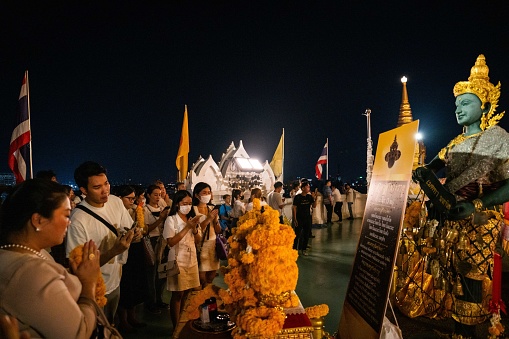 People pray to Phra Rahu, the Thai Lord of Darkness, at Wat Saket, also known as the Golden Mount, on the date of the 2023 astrological sign transition date, in Bangkok, Thailand on October 25, 2023. Those with unlucky Chinese zodiac horoscopes come to make black offerings and chant for better luck.