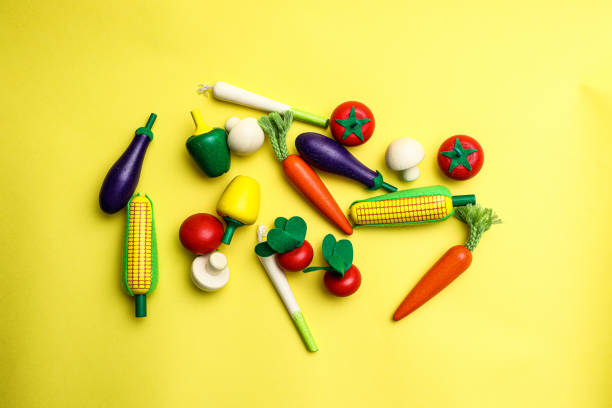 istock Fun and cute fruit children's toys. Yellow Background 1742051659