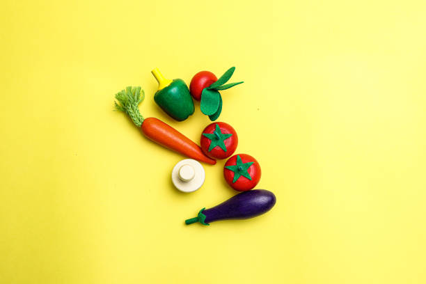 istock Fun and cute fruit children's toys. Yellow Background 1742051845