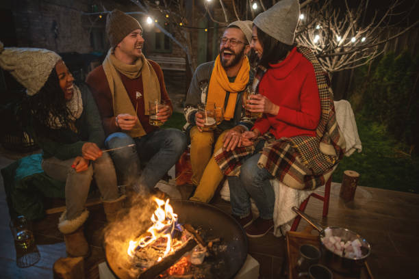 istock Friends enjoying by the campfire 1742063970