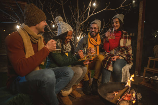 istock Friends enjoying by the campfire 1742065594
