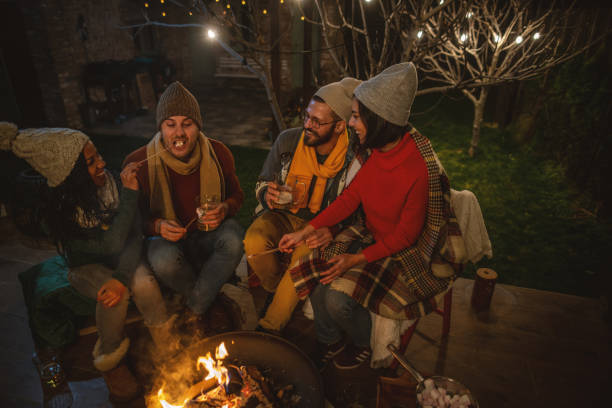 istock Friends enjoying by the campfire 1742066643