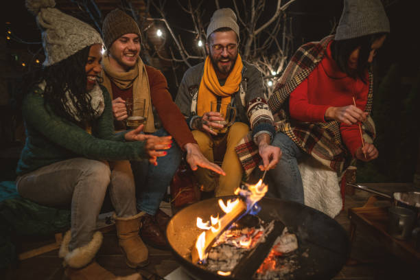 istock Friends enjoying by the campfire 1742067538