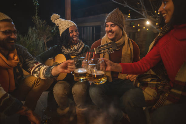 istock Happy friends around the Fire 1742070367