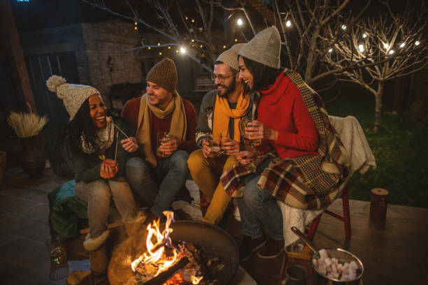 istock Friends enjoying by the campfire 1742072019