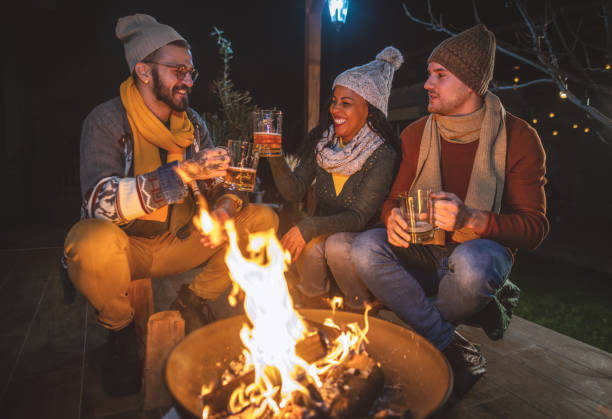 istock Friends enjoying by the campfire 1742074626