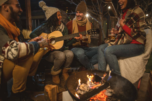 istock Happy friends around the Fire 1742075377