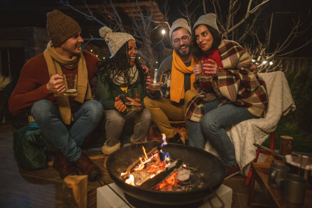 istock Friends enjoying by the campfire 1742079004