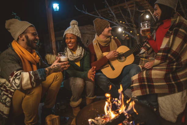 istock Happy friends around the Fire 1742080066