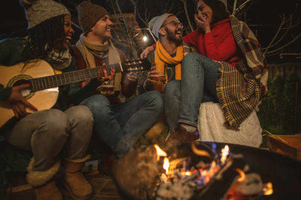 istock Happy friends around the Fire 1742081625