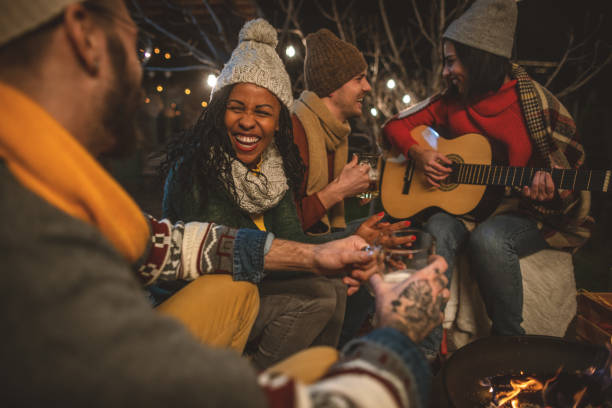 istock Happy friends around the Fire 1742083224