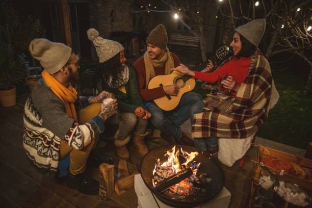 istock Happy friends around the Fire 1742085627
