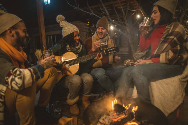istock Happy friends around the Fire 1742086562