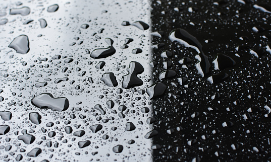 Condensation water drops on black glass background. Realistic clear droplets of dew or rain with light reflection on dark window surface. Pure liquid texture, wet pattern. 3D render illustration
