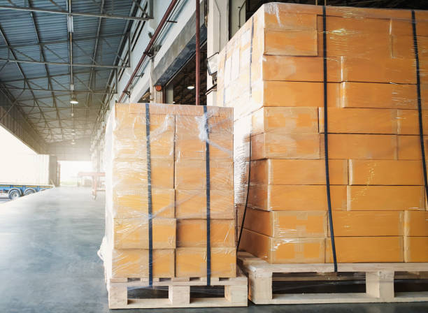 istock Package Boxes Wrapped Plastic Stacked on Pallets. Warehouse Shipping, Distribution Storehouse, Shipment Boxes, Supply Chain, Cargo Supplies Warehouse Logistic. 1742094098