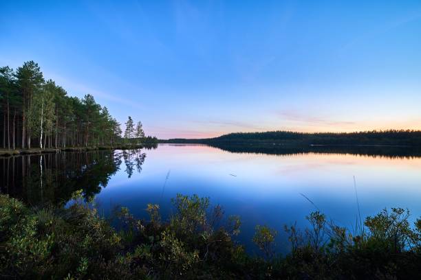 istock Scenic view of a tranquil lake at sunset 1742107218