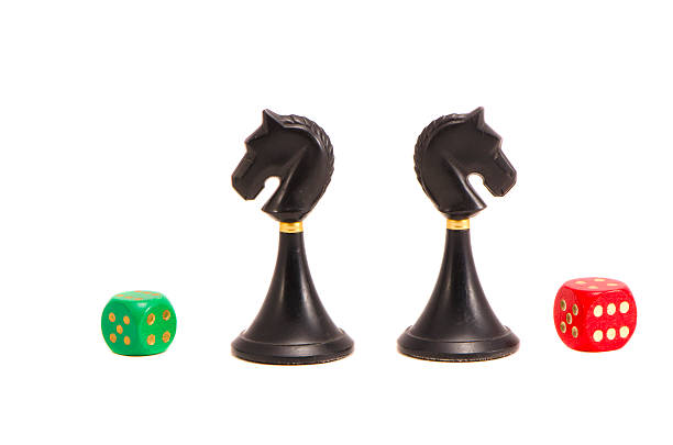 istock isolated two chess black knightes and dices 174210813