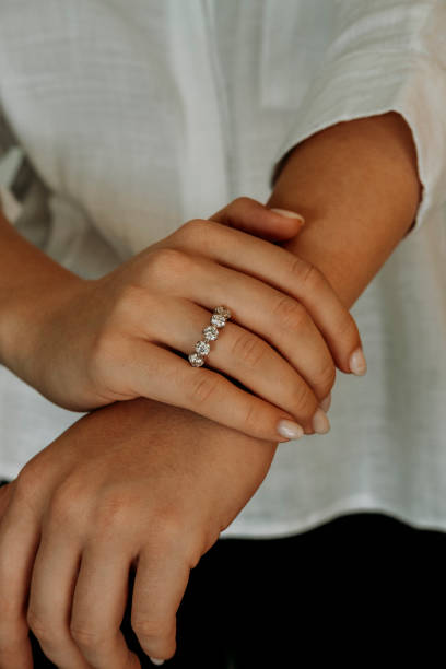 istock Young woman's hand wearing a diamond ring. wedding accessories bride. 1742117981