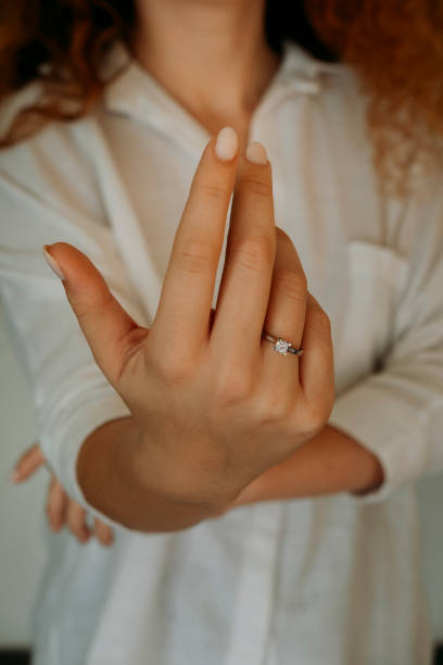 istock Young woman's hand wearing a diamond ring. wedding accessories bride. 1742117986