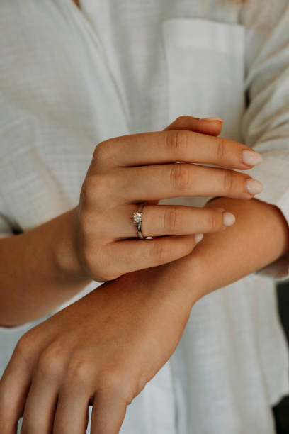 istock Young woman's hand wearing a diamond ring. wedding accessories bride. 1742117998